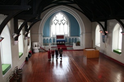 Parishioners of St Luke's in the large, empty church after it closed.